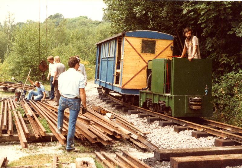 construction01.jpg - Hudson Hunslet HE3097 passes the stack of rail for the track to Amberley. Repairs to the Fauld Coach have been undertaken with painting not yet completed.