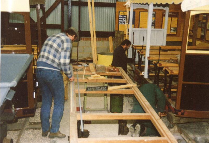 ggr-coach-build03.jpg - The coach on the left is No.4 which is the one rebuilt by the Worthing College students - original metal parts, with new wooden bodywork. In the centre is the new wooden chassis for replica coach No.9.
