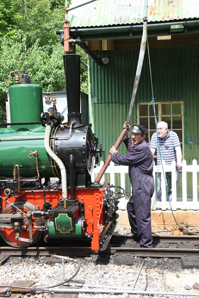 2016-07-120017.JPG - As both locomotives are well tanks an extra piece of pipe had to be employed to extend the hose on the water crane. Any leaks and the water will run up your arm.
