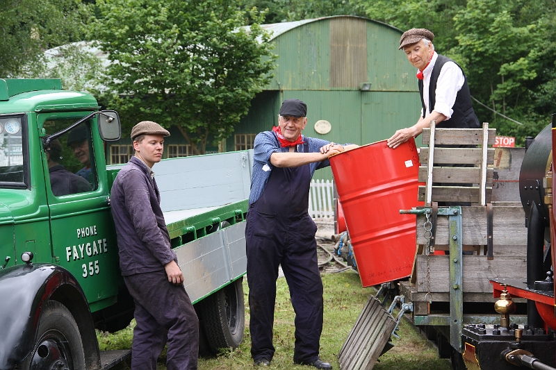 2016-07-120023.JPG - The day after Gala a photographic event organised by David Williams too place. Several set pieces were posed for the photogrpahers including this one of barrles being transferred from a train and loaded onto the Museum's vintage Bedford lorry. I'm not sure any of these railway volunteers earned their Equity membership cards though.